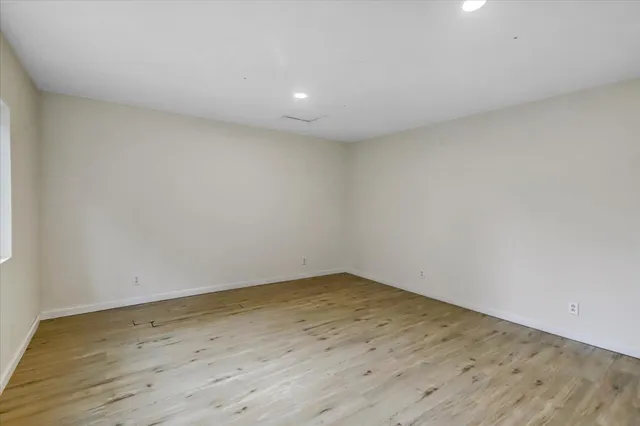 a front view of a house with yard and green space