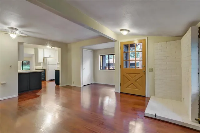 a large kitchen with stainless steel appliances and a sink