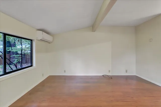 a kitchen with stainless steel appliances a refrigerator and a stove top oven