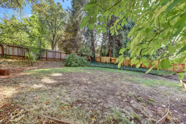 a room with a wooden floor and a window