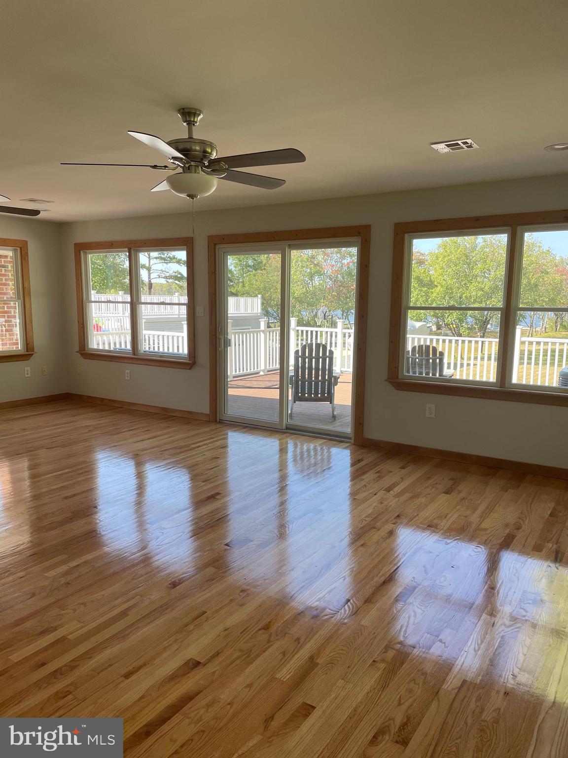 29 Dock Avenue Waretown, NJ 08758 - Photo 13 of 21 a view of an empty room with wooden floor and a window