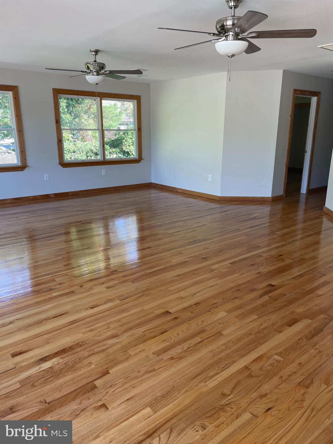 29 Dock Avenue Waretown, NJ 08758 - Photo 14 of 21 wooden floor in an empty room with a window