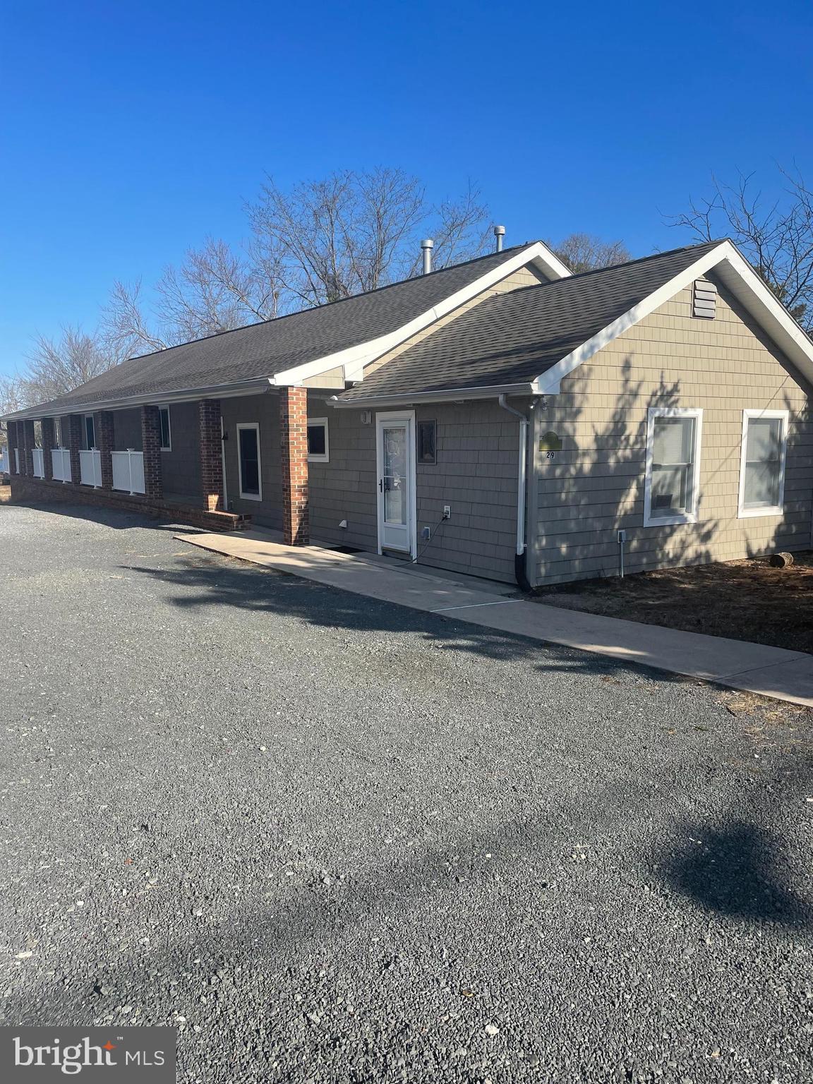 29 Dock Avenue Waretown, NJ 08758 - Photo 2 of 21 a front view of a house with a yard