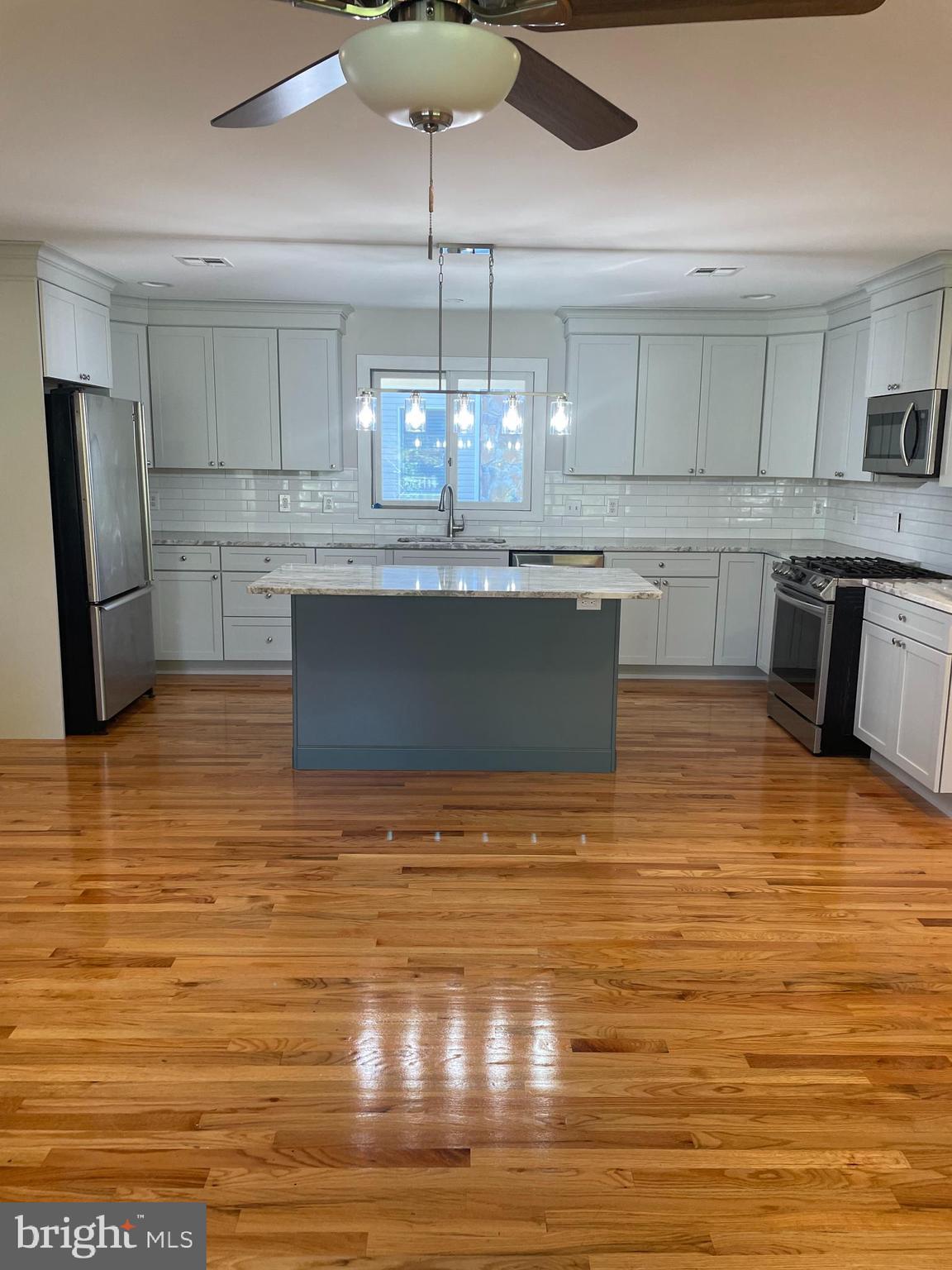 29 Dock Avenue Waretown, NJ 08758 - Photo 6 of 21 a kitchen with stainless steel appliances granite countertop a sink and cabinets