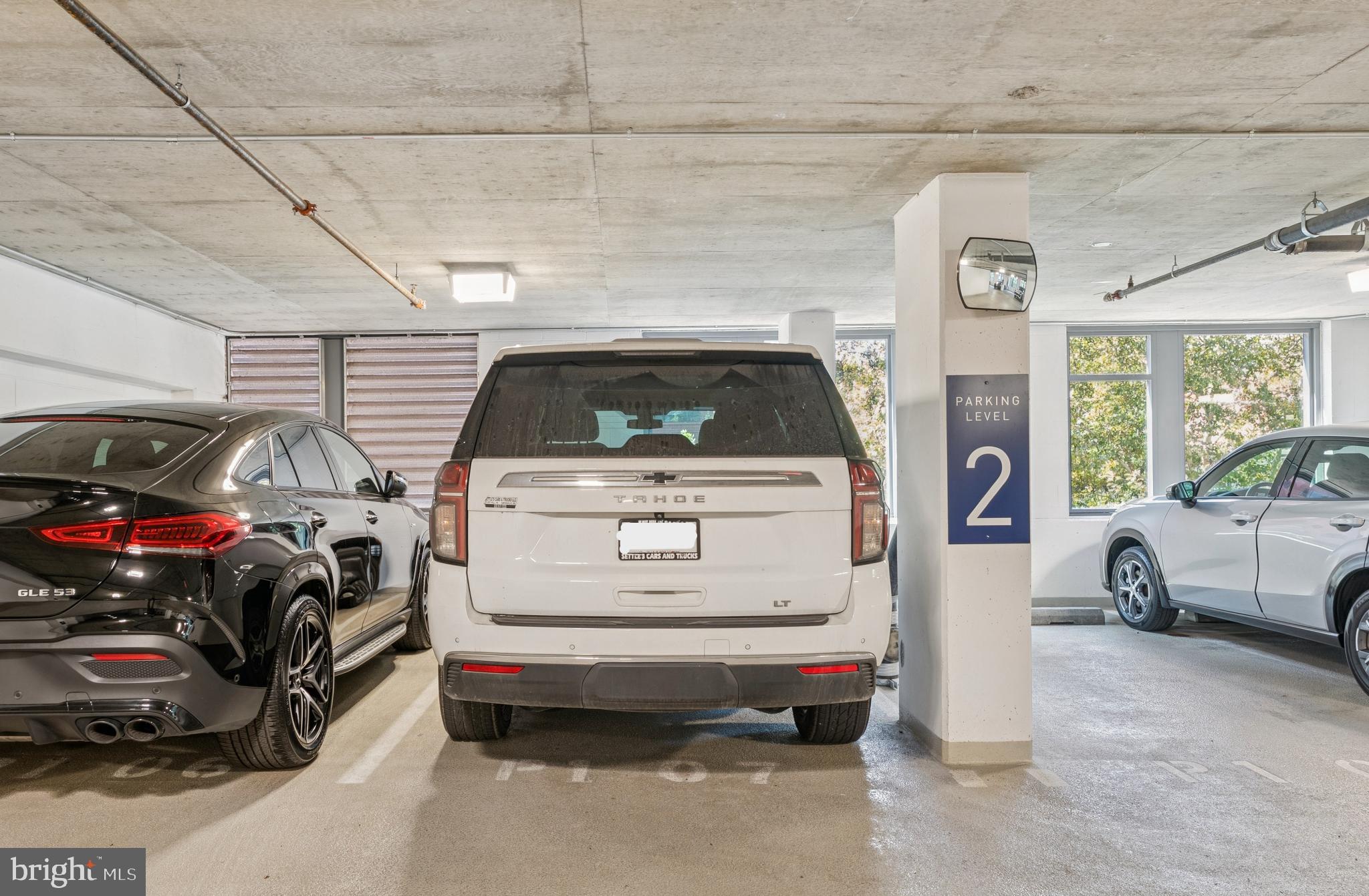 4960 Fairmont Avenue, Unit 904 Bethesda, MD 20814 - Photo 14 of 20 a utility room with a car parked in it