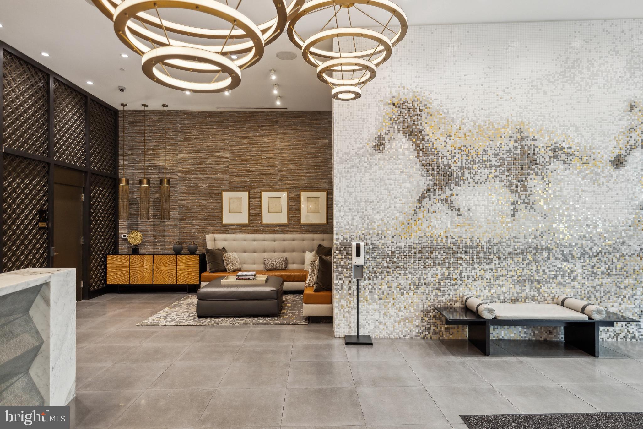 4960 Fairmont Avenue, Unit 904 Bethesda, MD 20814 - Photo 18 of 20 a living room with furniture and a fireplace