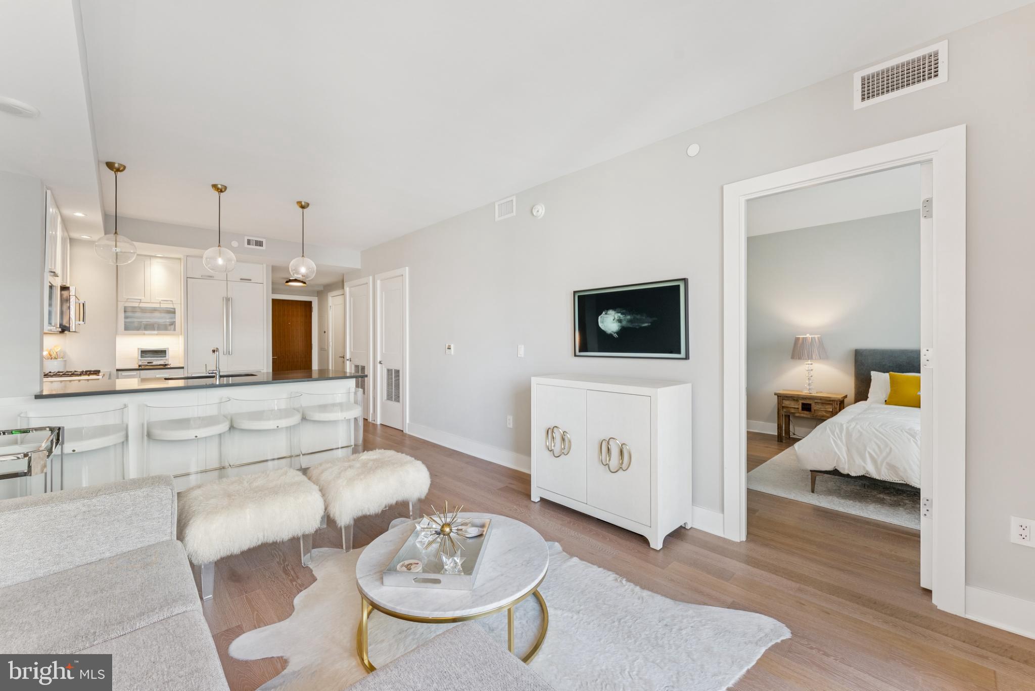 4960 Fairmont Avenue, Unit 904 Bethesda, MD 20814 - Photo 20 of 20 a living room with furniture and a wooden floor