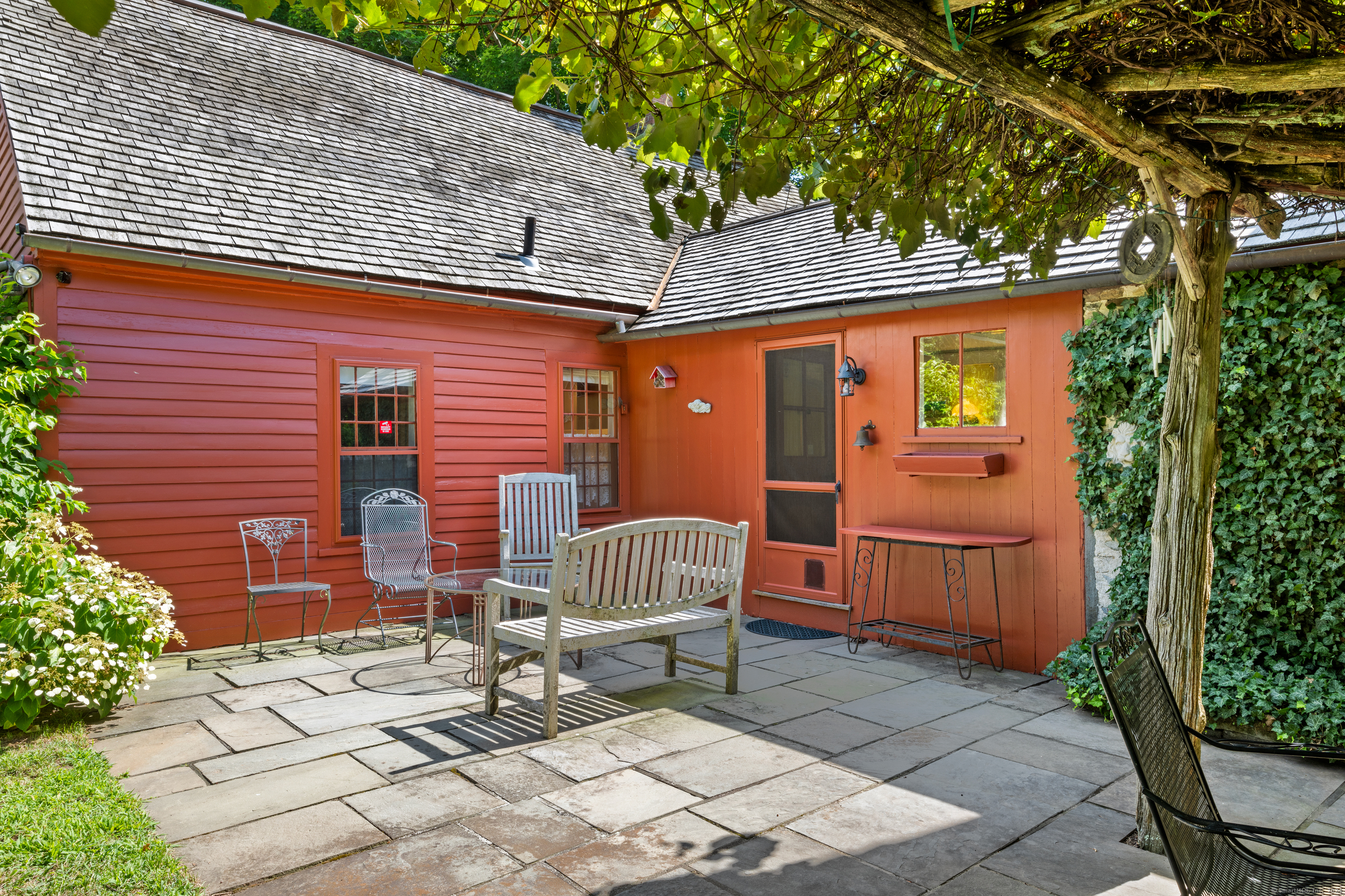 a front view of a house with a garden