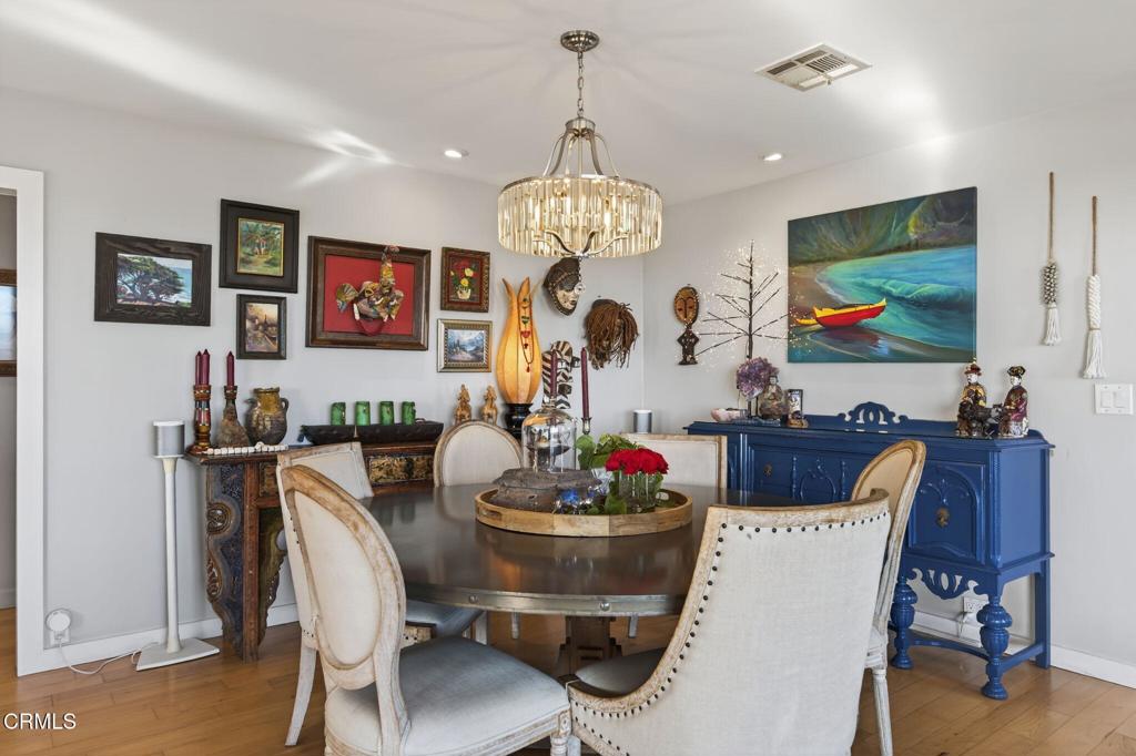 559 North Loop Drive Camarillo, CA 93010 - Photo 31 of 76 a view of a dining room with furniture wooden floor and a chandelier