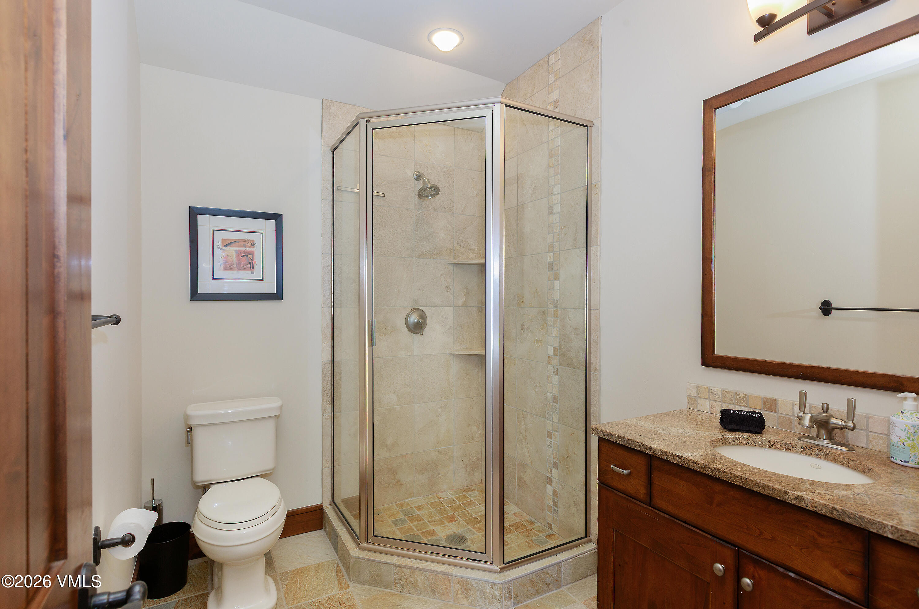2753 East Haystacker Drive Eagle, CO 81631 - Photo 29 of 41 a bathroom with a granite countertop sink toilet and shower