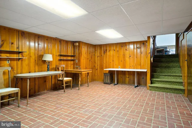 a view of a chairs and a table in a room