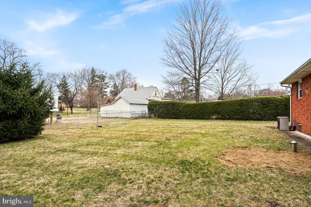a view of a yard with an outdoor seating