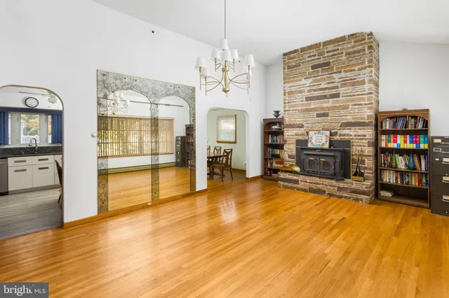 a living room with fireplace furniture and a flat screen tv
