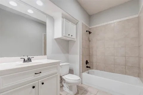 a bathroom with a sink vanity and a mirror