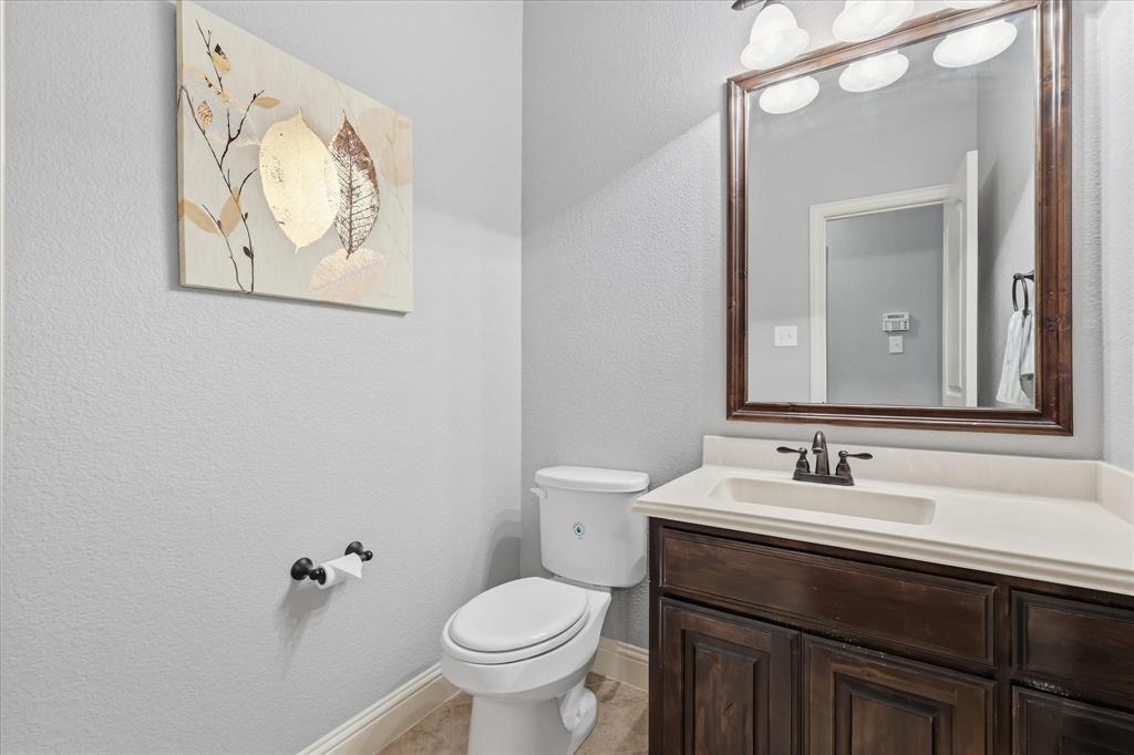 1105 Safrano Street Midlothian, TX 76065 - Photo 16 of 25 a bathroom with a sink and a mirror