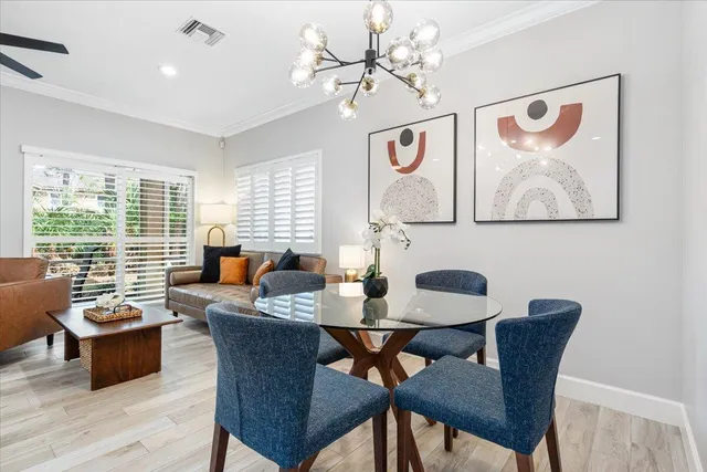 a living room with fireplace furniture and a large window