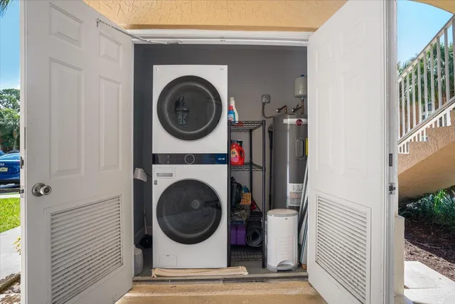 a front view of a house with a garden and plants
