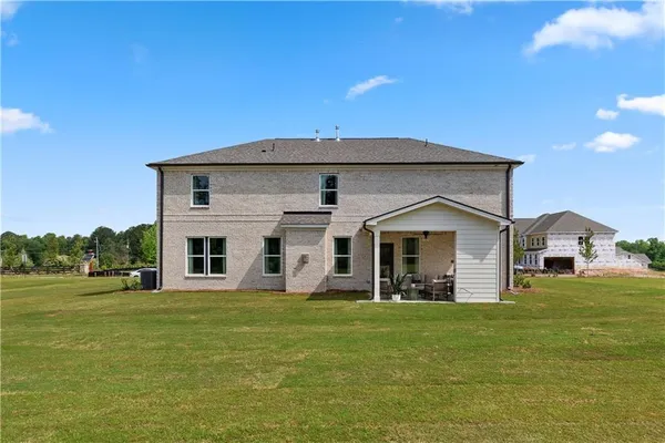 a front view of a house with a yard
