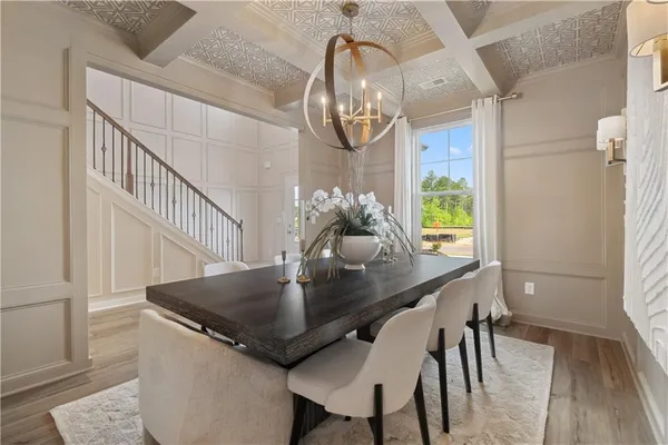 a view of a dining room with furniture and wooden floor