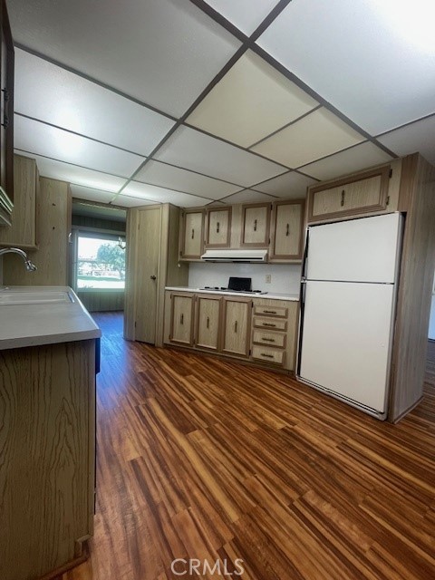 2230 Lake Park Drive, Unit 113 San Jacinto, CA 92583 - Photo 14 of 25 a kitchen with stainless steel appliances granite countertop a refrigerator a stove and a wooden floors