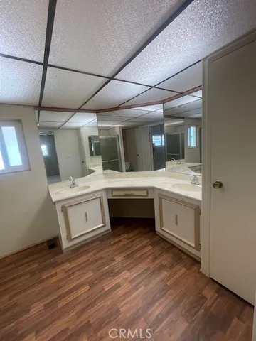 a bathroom with a double vanity sink and mirror