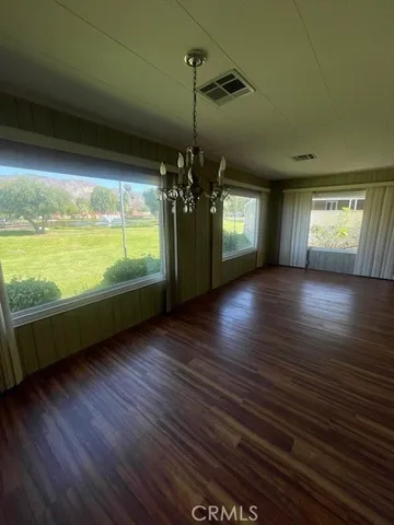 a view of a room with window wooden floor and windows