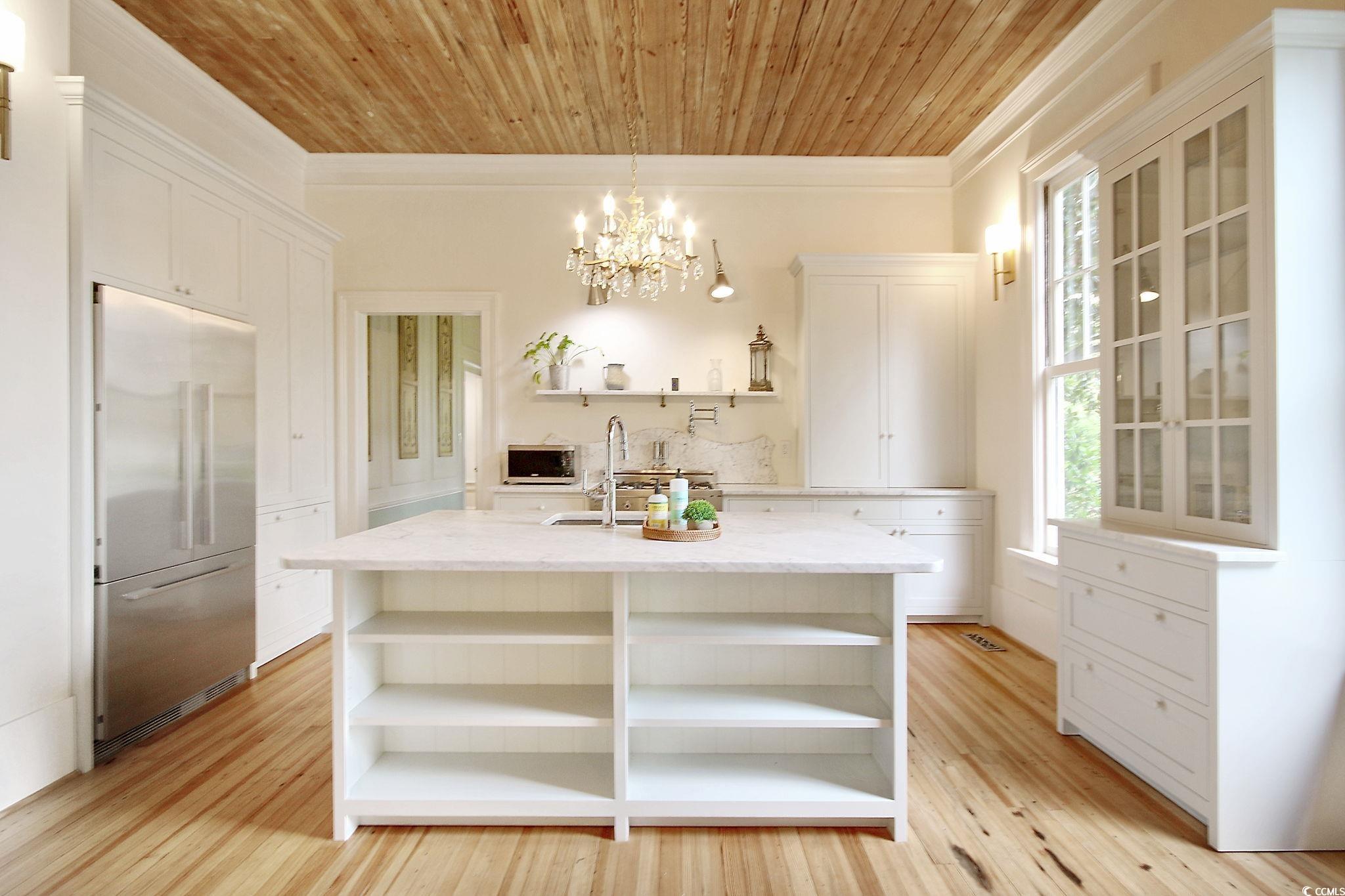 100 Northeast Ct Street Marion, SC 29571 - Photo 22 of 40 Kitchen featuring open shelves, white cabinets, appliances with stainless steel finishes, wood ceiling, and pendant lighting