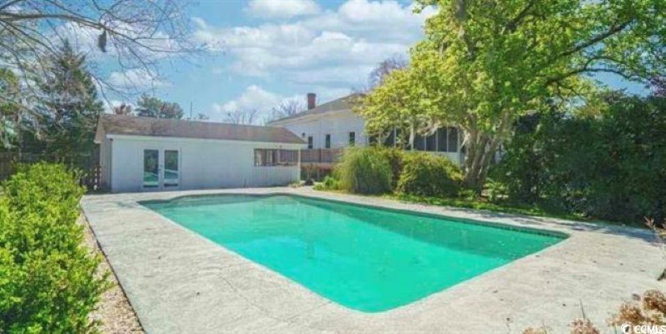 100 Northeast Ct Street Marion, SC 29571 - Photo 32 of 40 Swimming pool with a storage structure, an outdoor structure, and a patio area