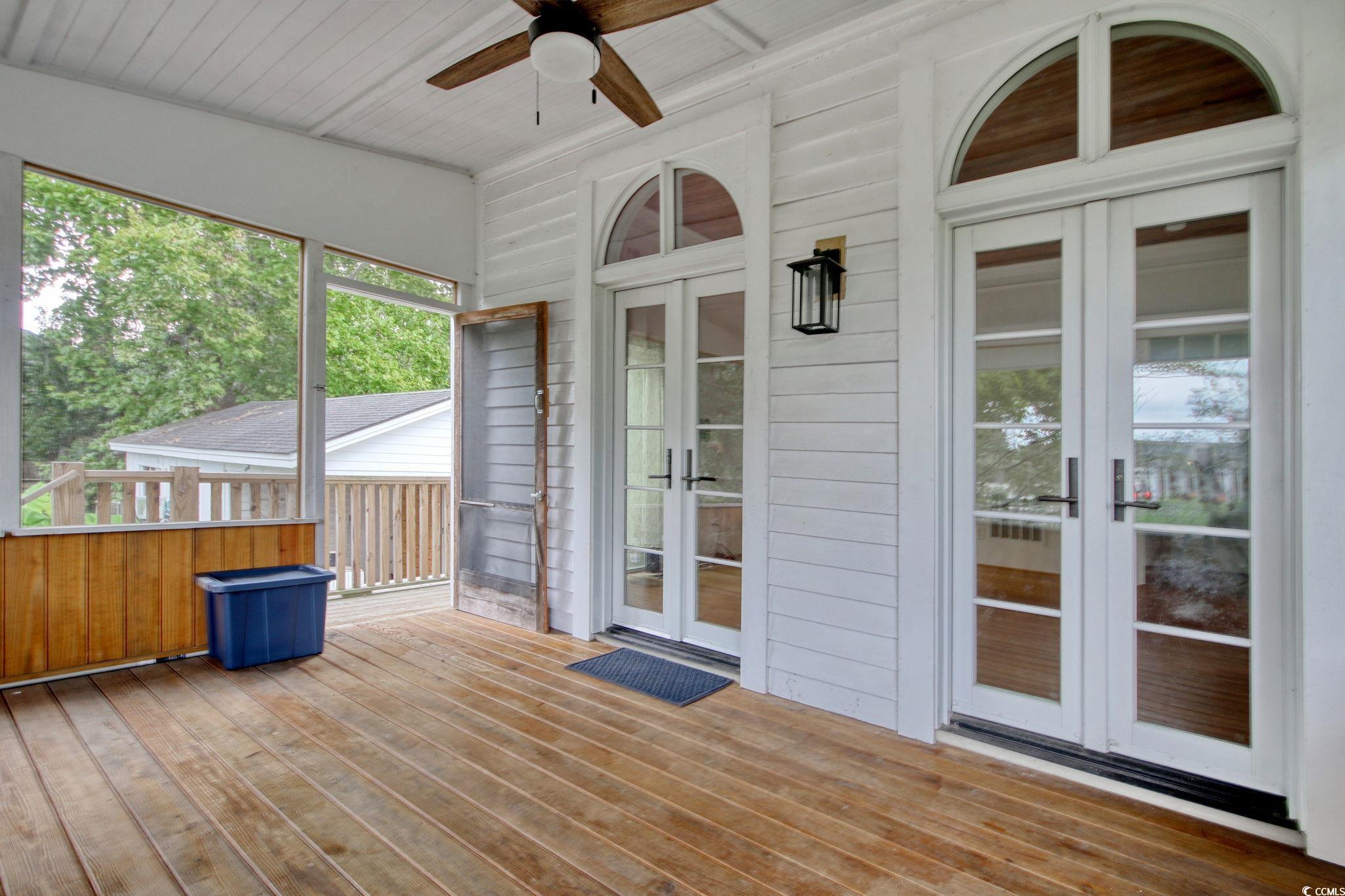 100 Northeast Ct Street Marion, SC 29571 - Photo 34 of 40 Unfurnished sunroom with french doors, healthy amount of natural light, and a wooden deck