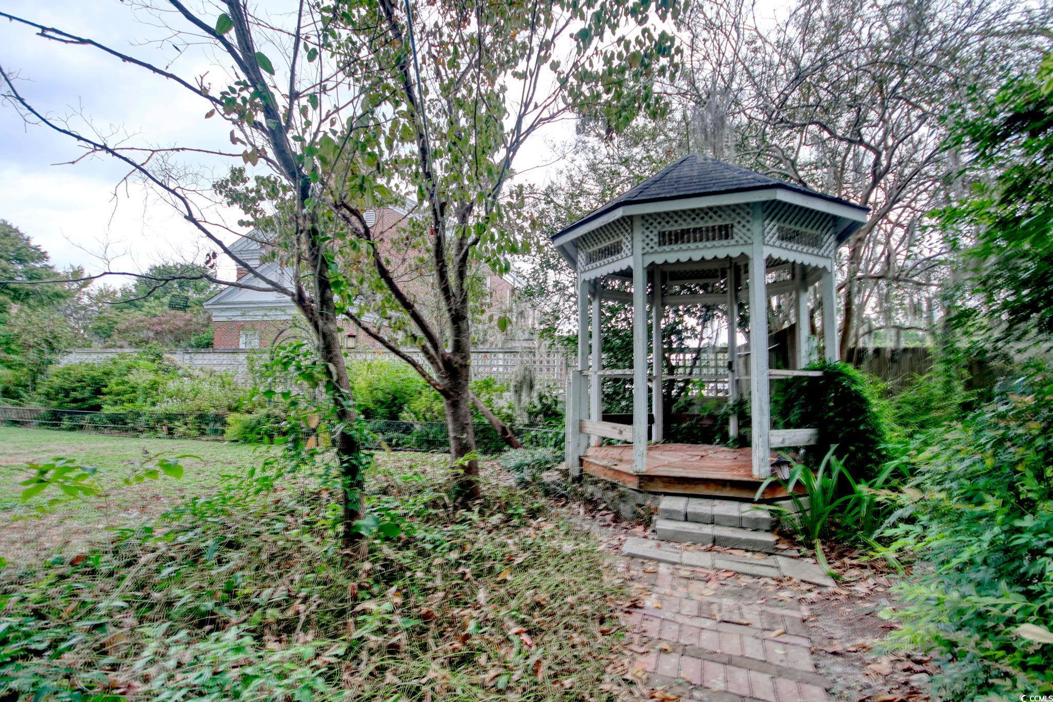 100 Northeast Ct Street Marion, SC 29571 - Photo 37 of 40 Fenced backyard with a gazebo and a deck