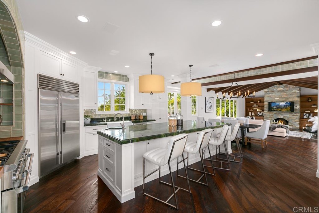 14910 Rancho Nuevo Del Mar, CA 92014 - Photo 11 of 54 a kitchen with stainless steel appliances granite countertop a stove and refrigerator