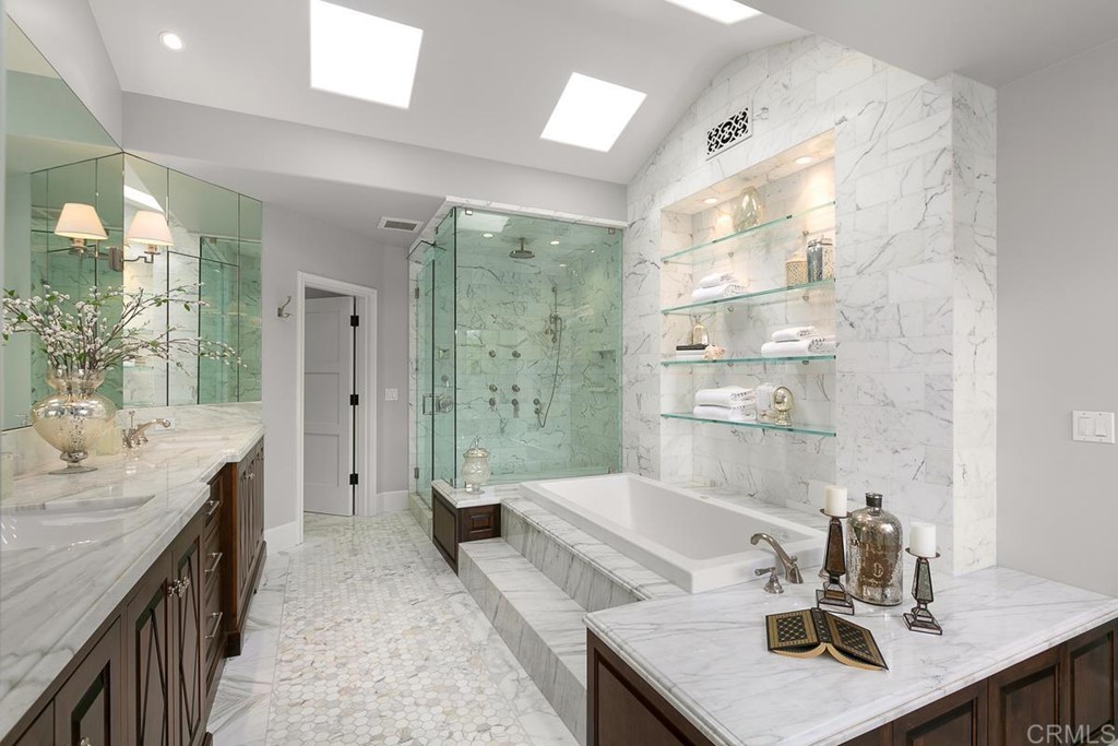 14910 Rancho Nuevo Del Mar, CA 92014 - Photo 19 of 54 a spacious bathroom with a granite countertop sink a toilet a mirror and shower
