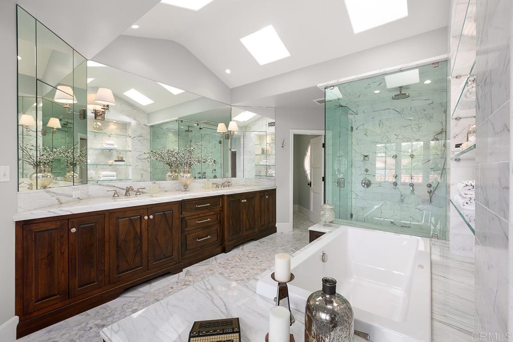 14910 Rancho Nuevo Del Mar, CA 92014 - Photo 20 of 54 a spacious bathroom with a tub sink shower and mirror