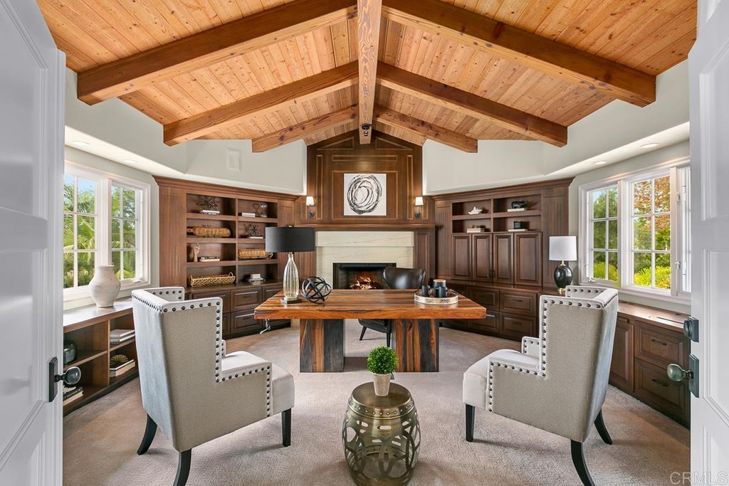 14910 Rancho Nuevo Del Mar, CA 92014 - Photo 23 of 54 a living room with furniture a fireplace and a large window