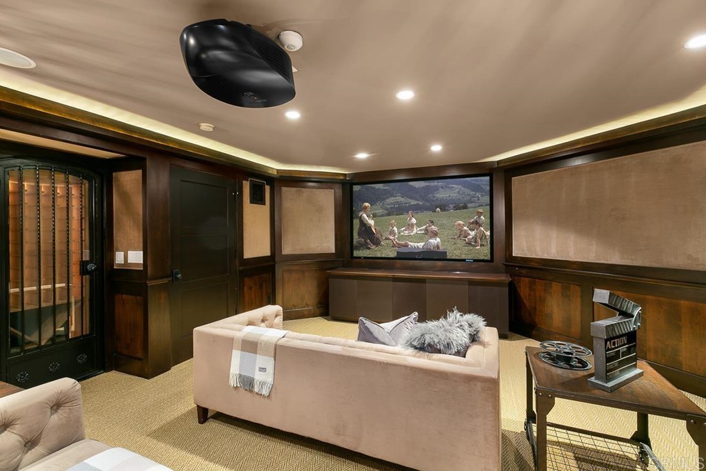 14910 Rancho Nuevo Del Mar, CA 92014 - Photo 24 of 54 a living room with furniture and a flat screen tv