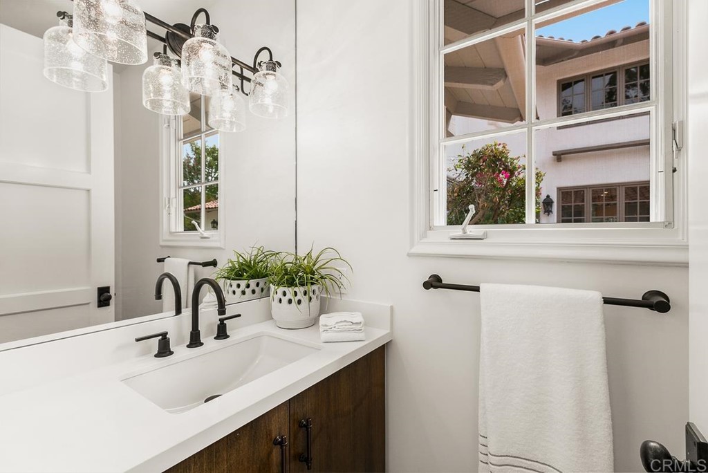 14910 Rancho Nuevo Del Mar, CA 92014 - Photo 28 of 54 a bathroom with a sink and a mirror