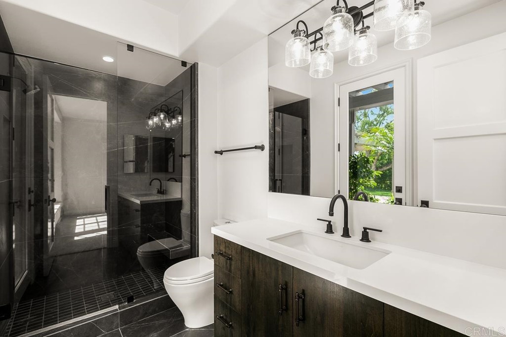 14910 Rancho Nuevo Del Mar, CA 92014 - Photo 30 of 54 a bathroom with a sink vanity toilet and shower