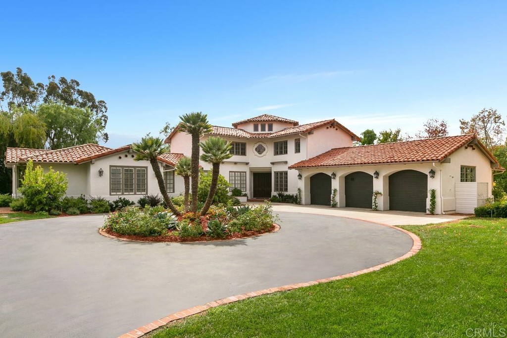 14910 Rancho Nuevo Del Mar, CA 92014 - Photo 4 of 54 a front view of a house with a garden