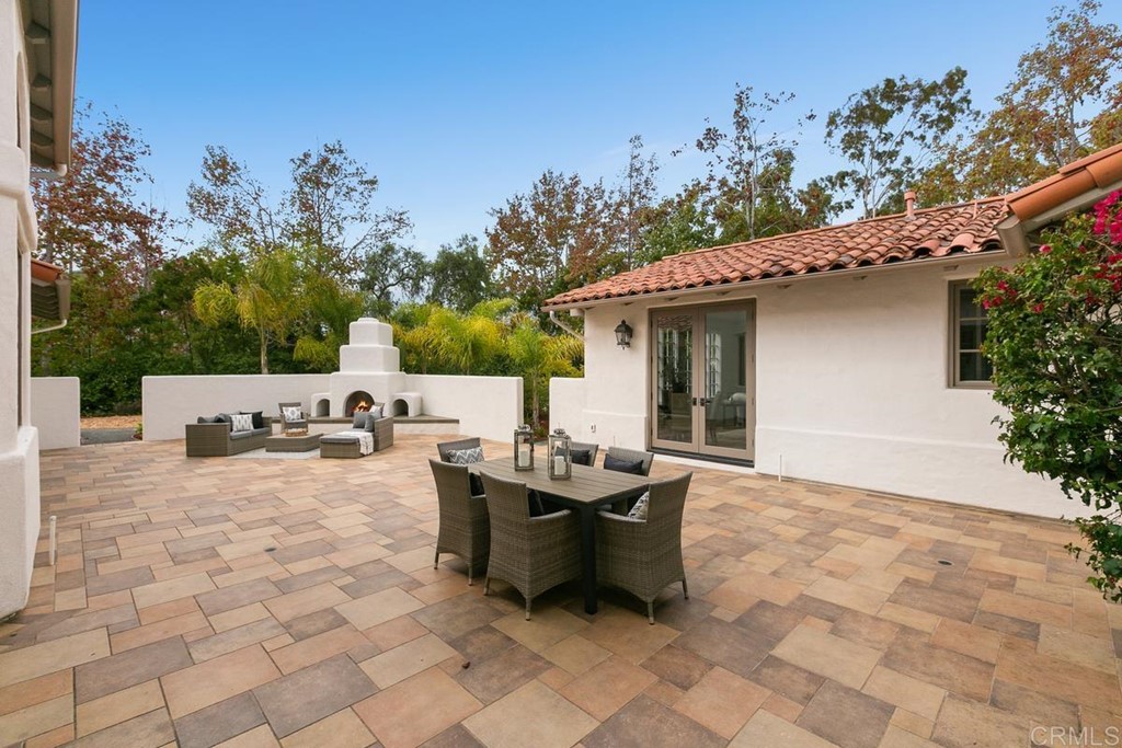 14910 Rancho Nuevo Del Mar, CA 92014 - Photo 36 of 54 a backyard of a house with table and chairs
