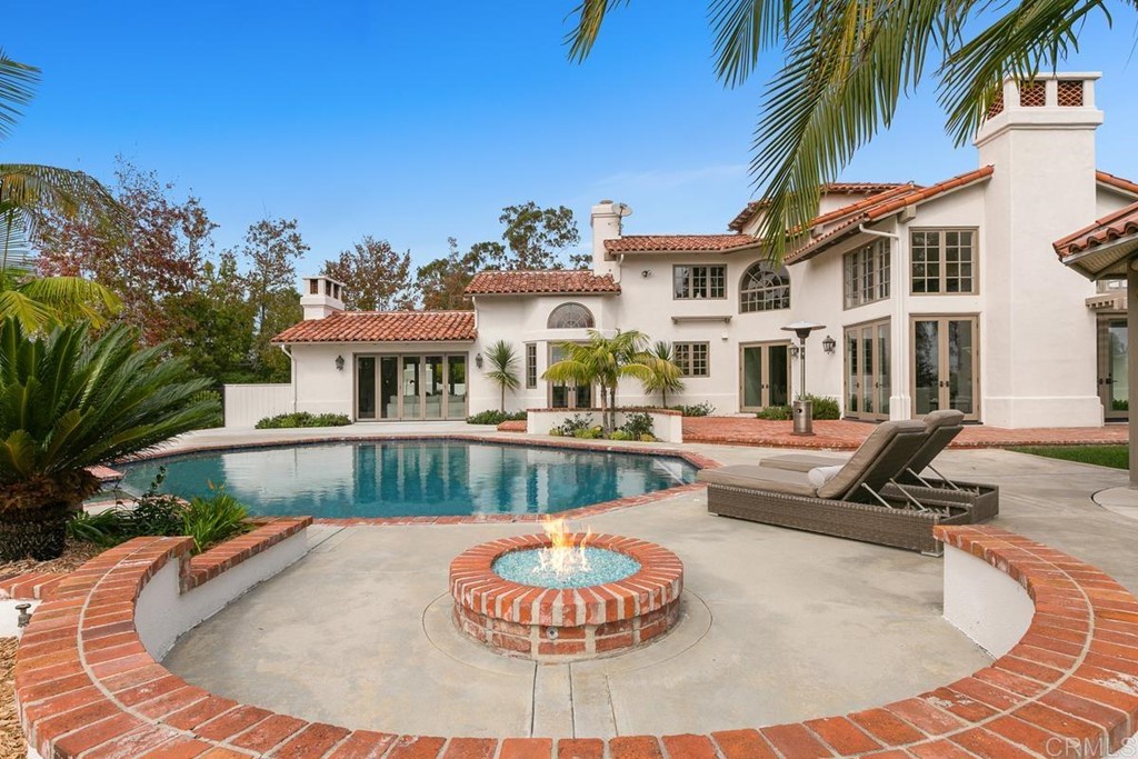 14910 Rancho Nuevo Del Mar, CA 92014 - Photo 41 of 54 a view of a house with swimming pool and a sitting space