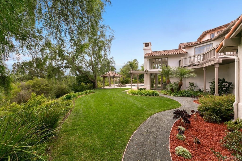 14910 Rancho Nuevo Del Mar, CA 92014 - Photo 44 of 54 a front view of a house with a yard