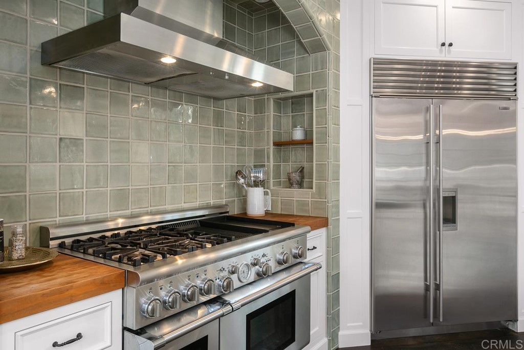 14910 Rancho Nuevo Del Mar, CA 92014 - Photo 10 of 54 a stove top oven sitting inside of a kitchen