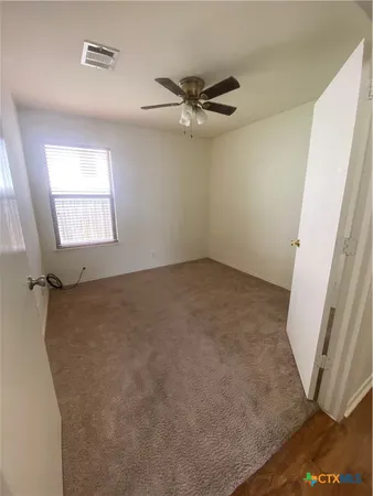 a view of a room with a window