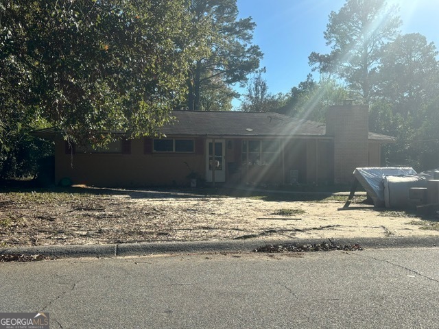 a house with trees in the background