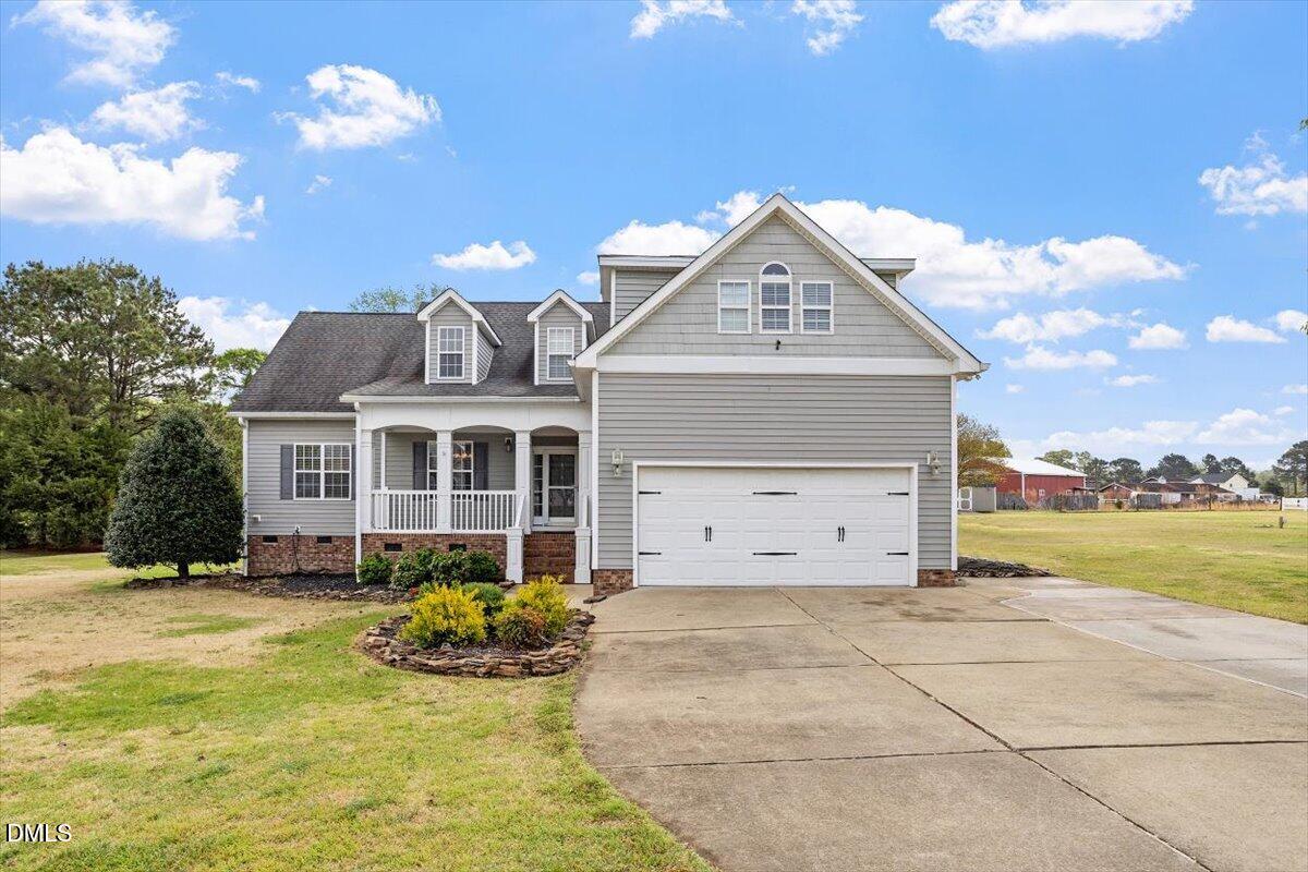 118 Victory Circle Willow Spring, NC 27592 - Photo 1 of 42 a front view of a house with a yard