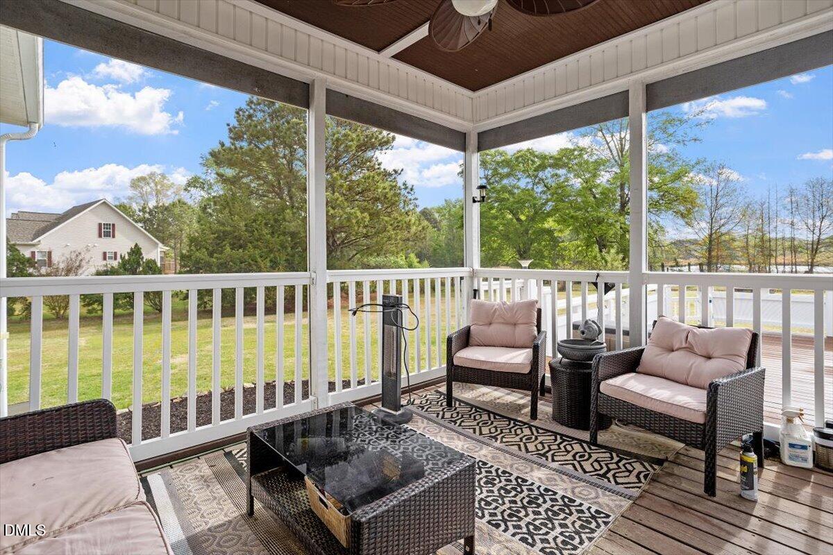 118 Victory Circle Willow Spring, NC 27592 - Photo 10 of 42 a view of a chairs and table in the deck