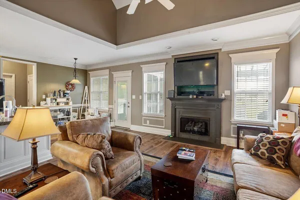 a dining room with a table chairs and wooden floor