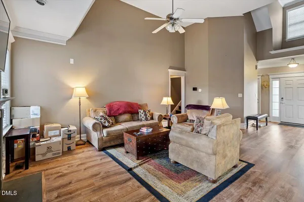 a living room with furniture and a fireplace