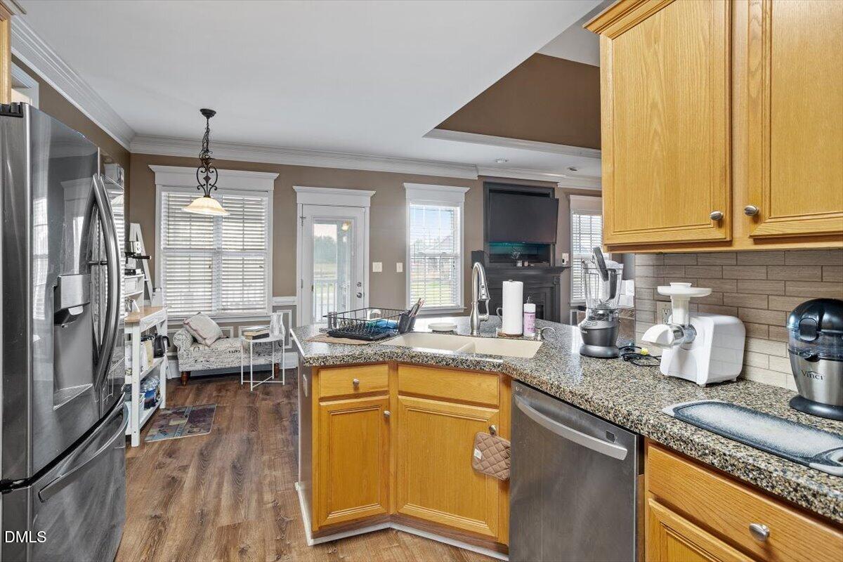 118 Victory Circle Willow Spring, NC 27592 - Photo 20 of 42 a kitchen with sink refrigerator and window