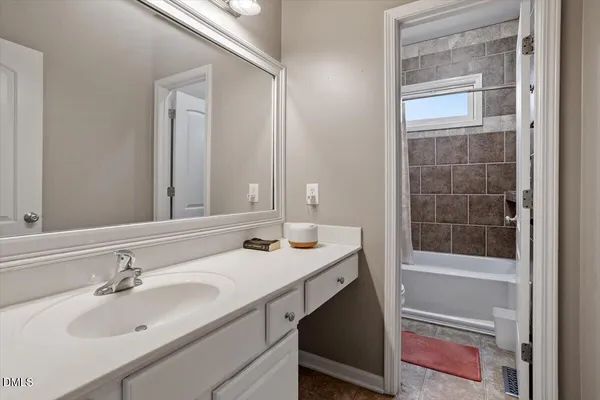 a kitchen view with stainless steel appliances kitchen island granite countertop a refrigerator a stove and a dining table with wooden floor